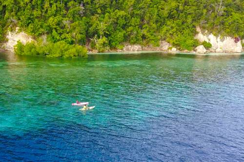 Kayak on Yeben cliff, Raja Ampat