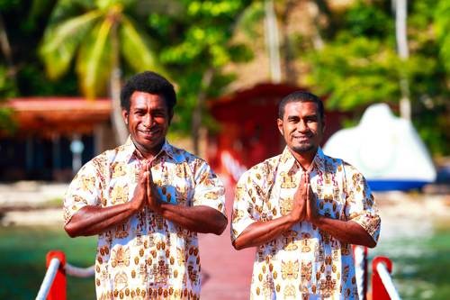 Local Papuan staff greeting upon arrival at Cove Eco Resort, Raja Ampat